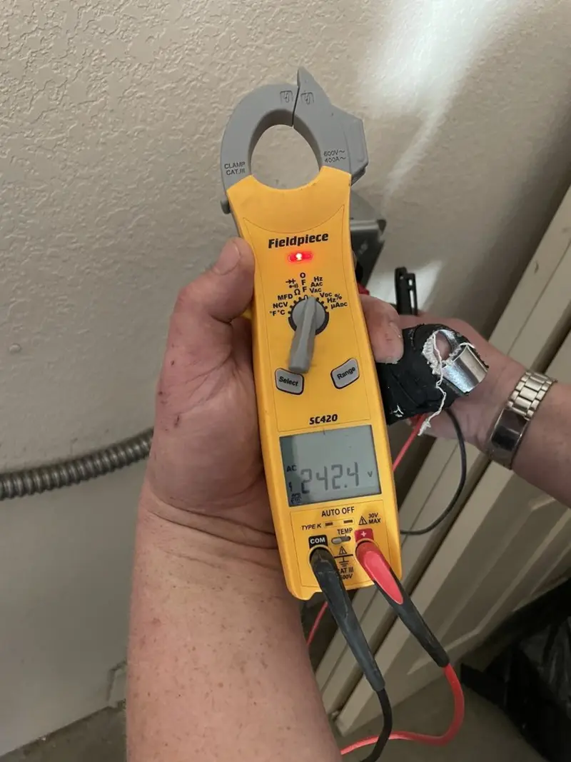 Voltage testing with clamp meter during Outlet Installation in La Grange